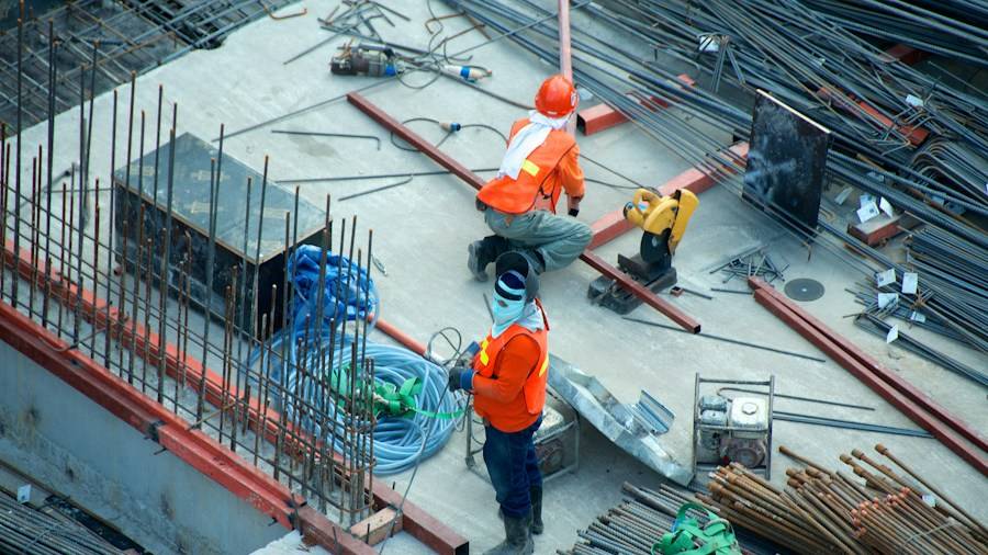 Construction workers on a building site seen from above
