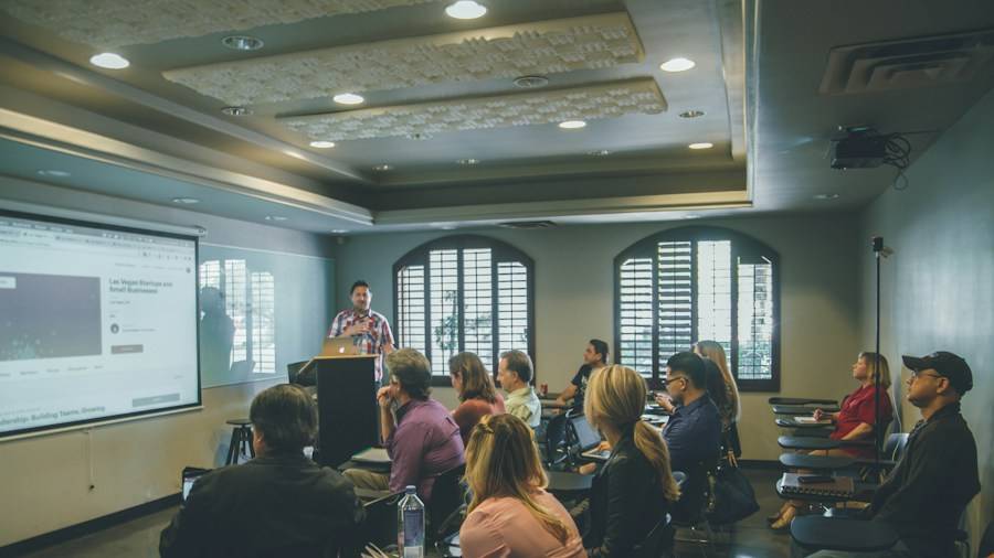 Training session with attendees facing a projector screen