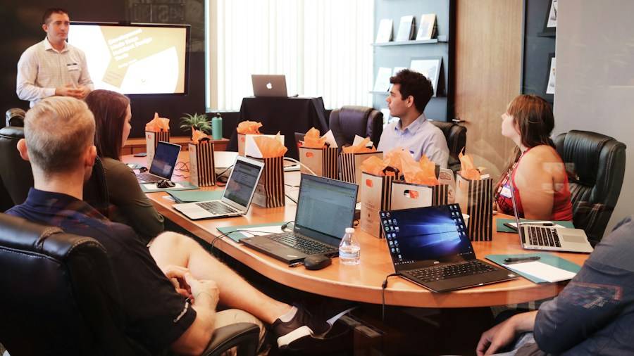 Team meeting in a conference room with laptops